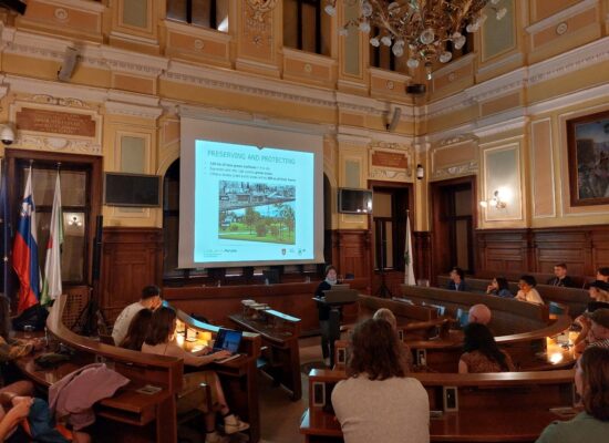 Photo 2: Sitting in the historic plenary hall of Ljubljana’s town hall while Simona Berden is giving a lecture on Lubljana's efforts in becoming the European Green Capital of 2016 (©Thurner, 2023)